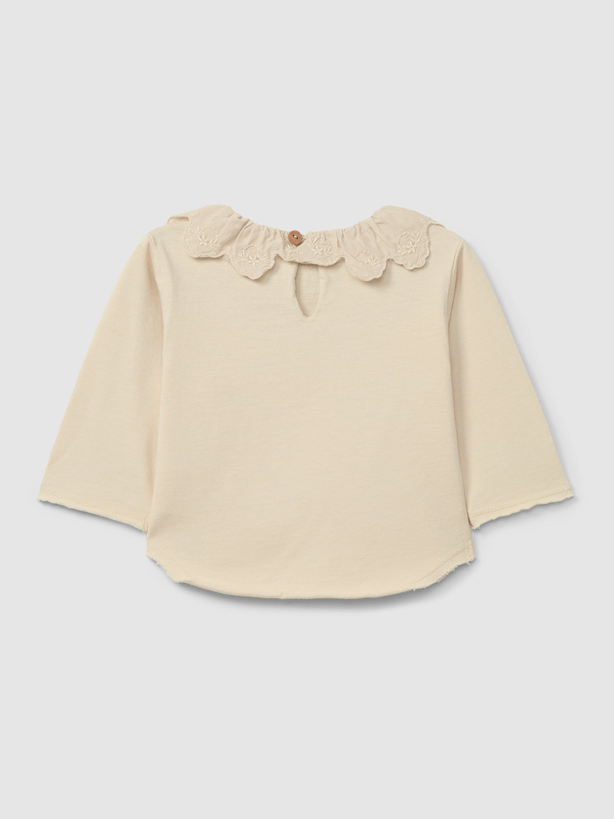 Maglia in cotone biologico a maniche lunghe con colletto inglese ricamato con volant