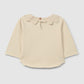 Maglia in cotone biologico a maniche lunghe con colletto inglese ricamato con volant