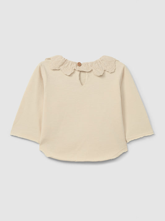 Maglia in cotone biologico a maniche lunghe con colletto inglese ricamato con volant