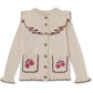 Nova cardigan con ricamo e volant