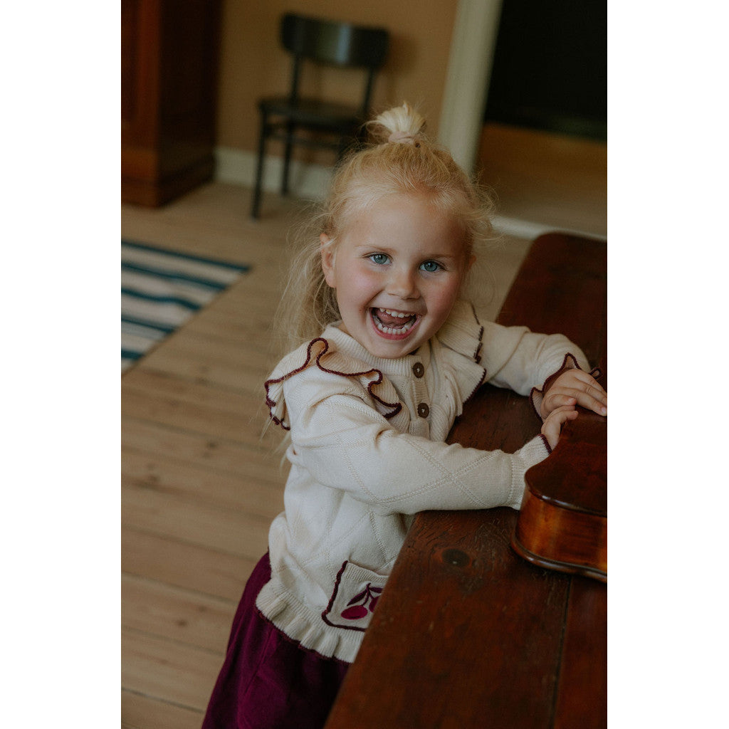 Nova cardigan con ricamo e volant