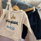 Pantaloni pull-up in velluto a coste con tasca