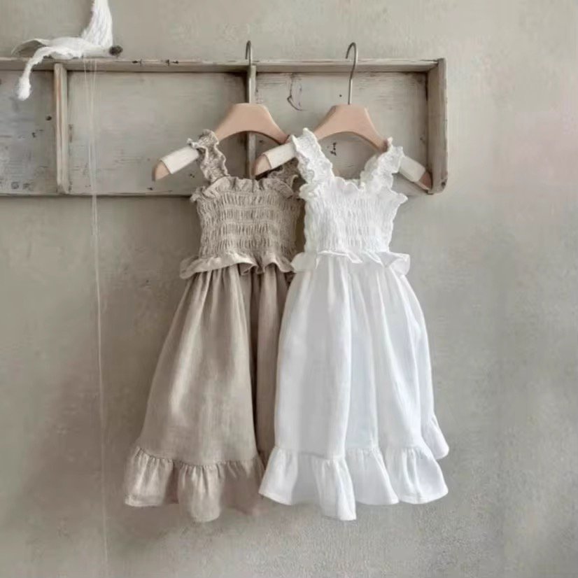 Vestito Raya con cinturino e volant in punto smock 
