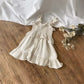 Vestito Raya con cinturino e volant in punto smock 